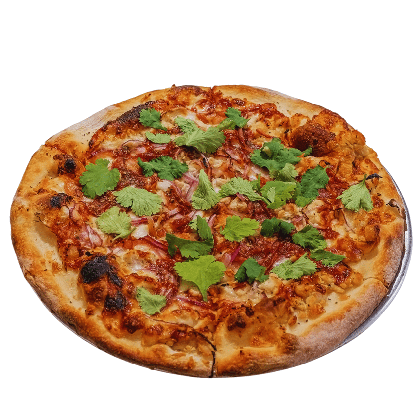 A pizza topped with cilantro, cheese, and pieces of meat, presented on a round crust.